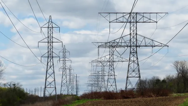 Transmission lines run through a field.