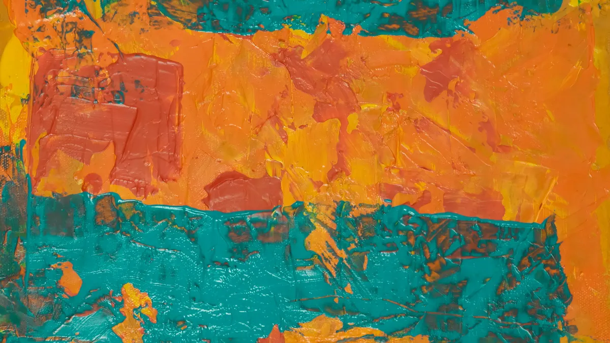 An orange and teal splash painting.
