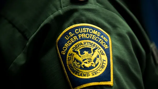 A U.S. Customs and Border Protection patch on the sleeve of a CBP official.