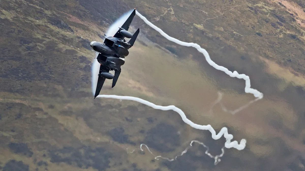 A United States Air Force F-15 fighter jet based at RAF Lakenheath speeds through the Dinas Pass