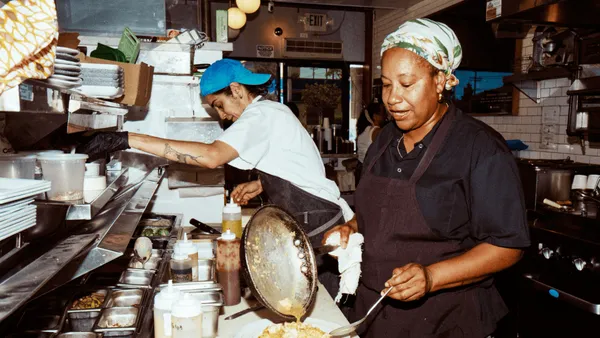 Two people working in the restaurant My 2 Cents.