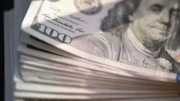 A stack of hundred dollar bills.