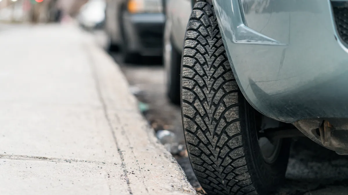 Tire turned into the curb.