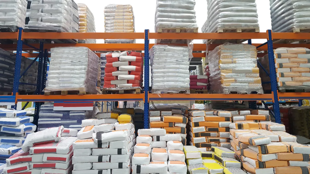 Cement bags are on display at a construction warehouse.