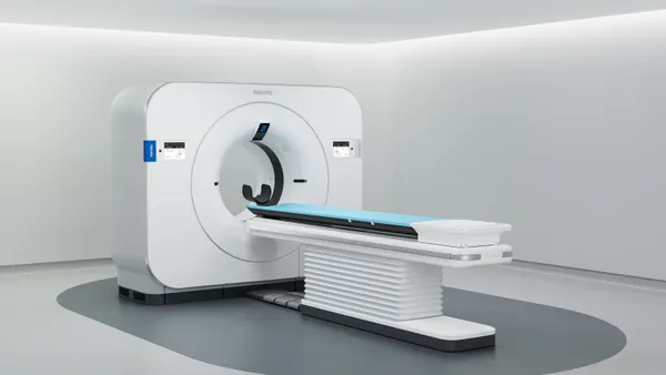 A CT imaging machine in a white room.