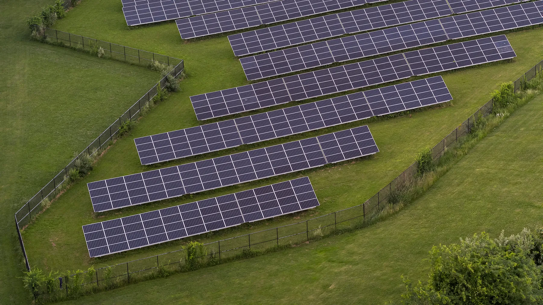 Solar power station and solar energy panels on the green field in Chester, New Jersey.