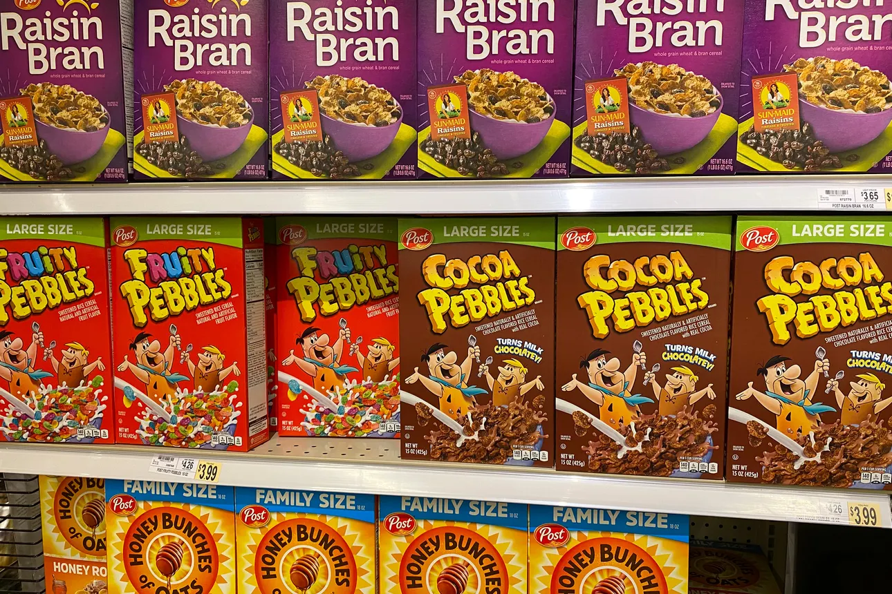 Several of Post's cereal brands, including Raisin Bran and Fruity Pebbles, are displayed in a grocery store shelf in Washington, D.C..