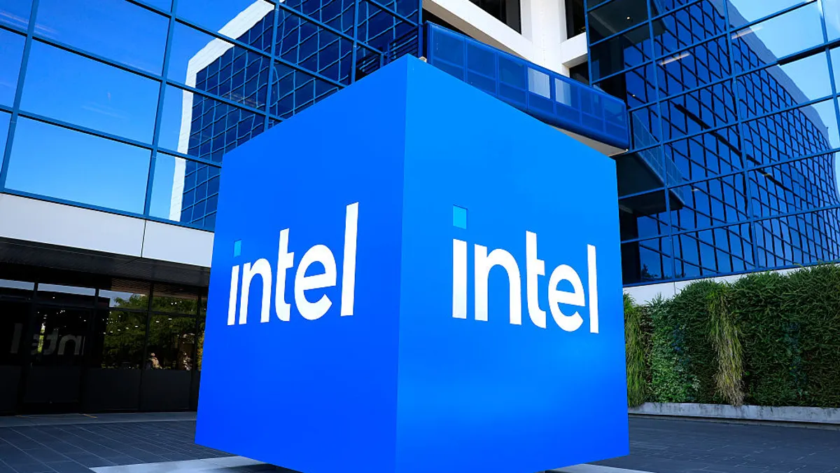 The Intel logo is displayed on a sign in front of Intel headquarters in Santa Clara, California.