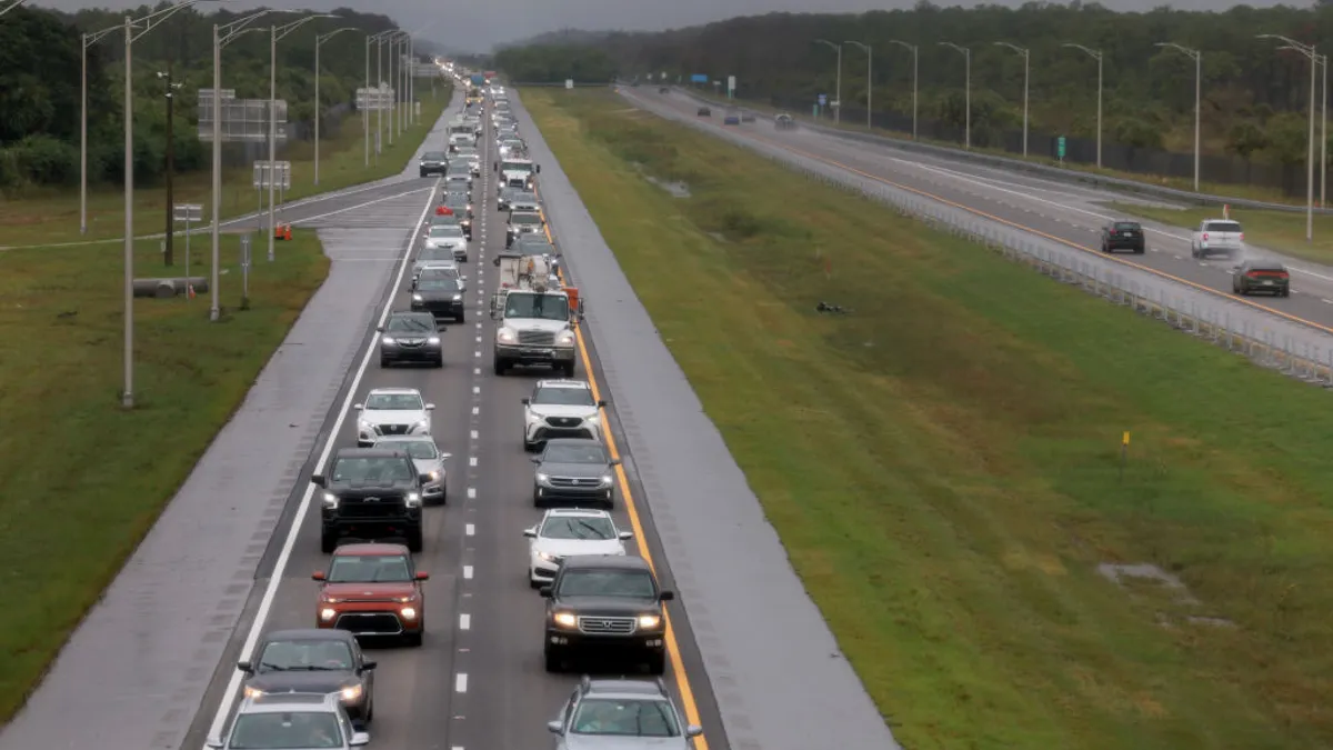 Vehicles crowd one side of the highway in Florida