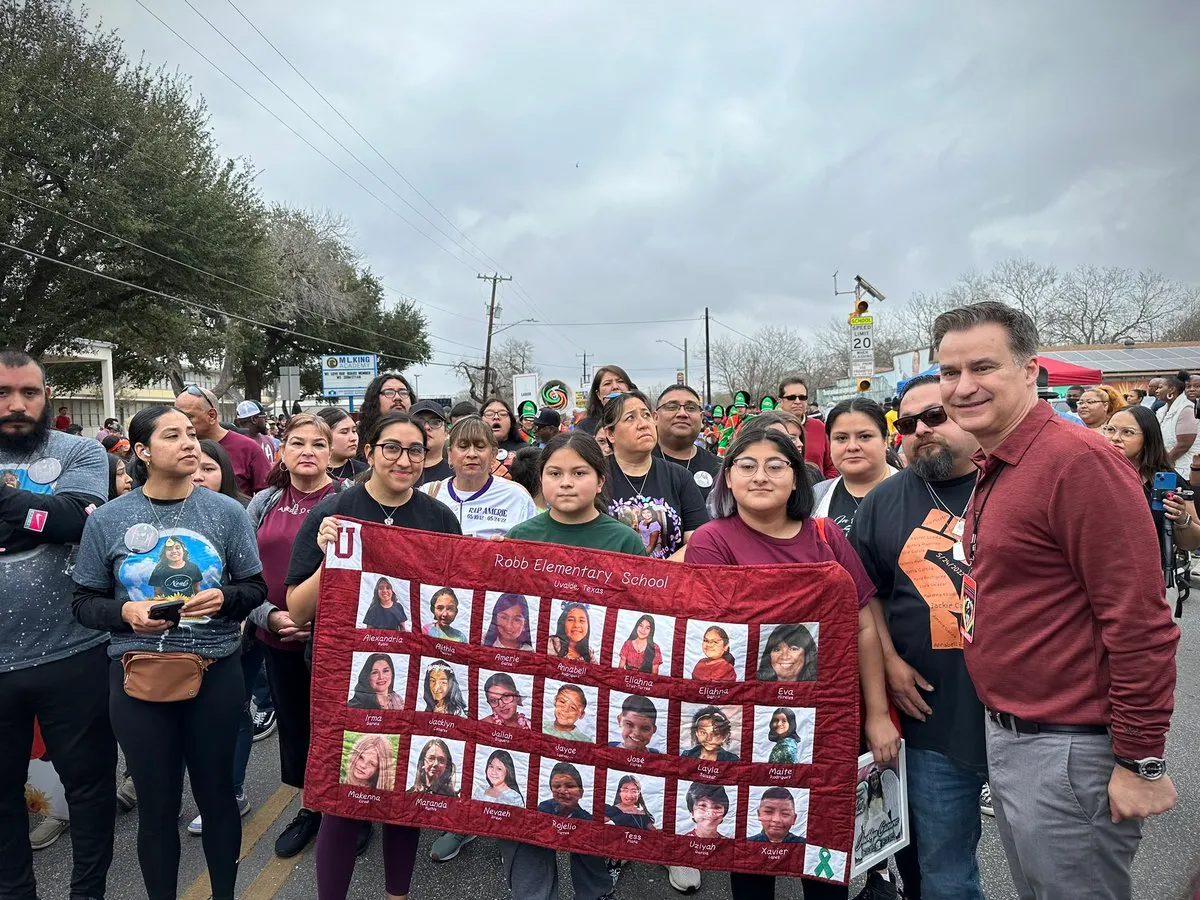 Texas state Sen. Roland Gutierrez marches with families of Uvalde victims on Jan. 16, 2023.