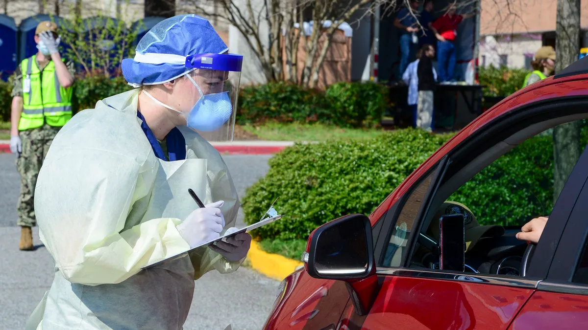 Official U.S. Navy PageFollow Sailor screens a patient in their car at Naval Medical Center Portsmouth’s COVID-19 drive thru screening