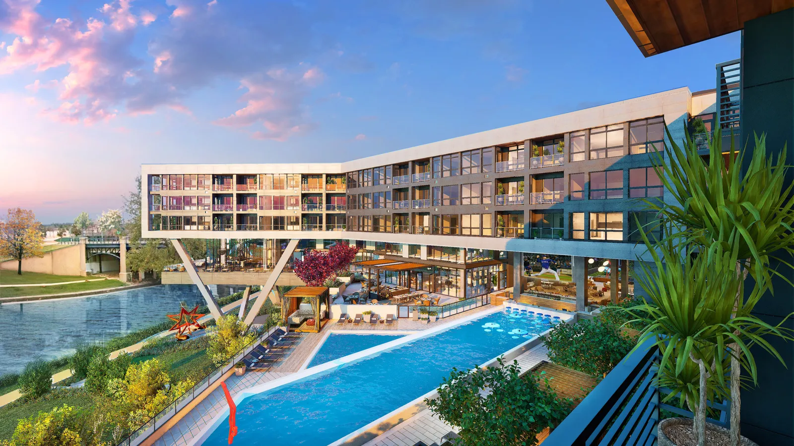 A pool at the base of an apartment building.