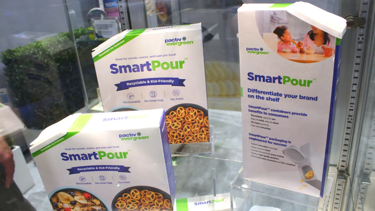 Three different sizes of cartons that bear branding for Pactiv Evergreen's SmartPour.