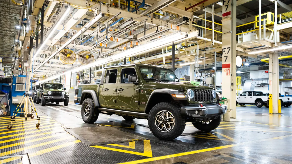 A green 2024 Jeep Gladiator comes off the final assembly line at Stellantis' Toledo Assembly Complex.