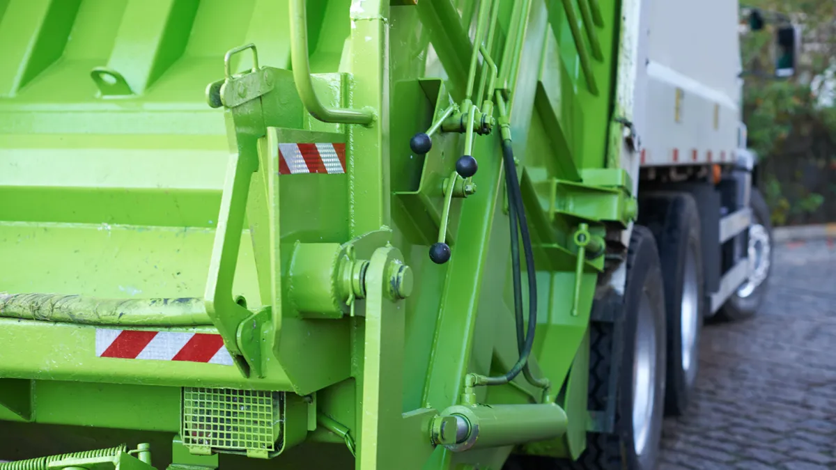 The back of a garbage truck.