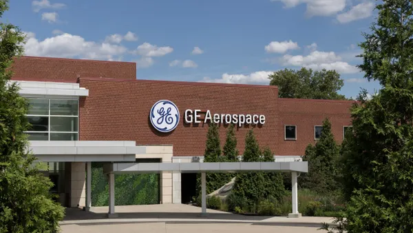 A red brick building with the blue and white GE logo next to the GE Aerospace text on the front.