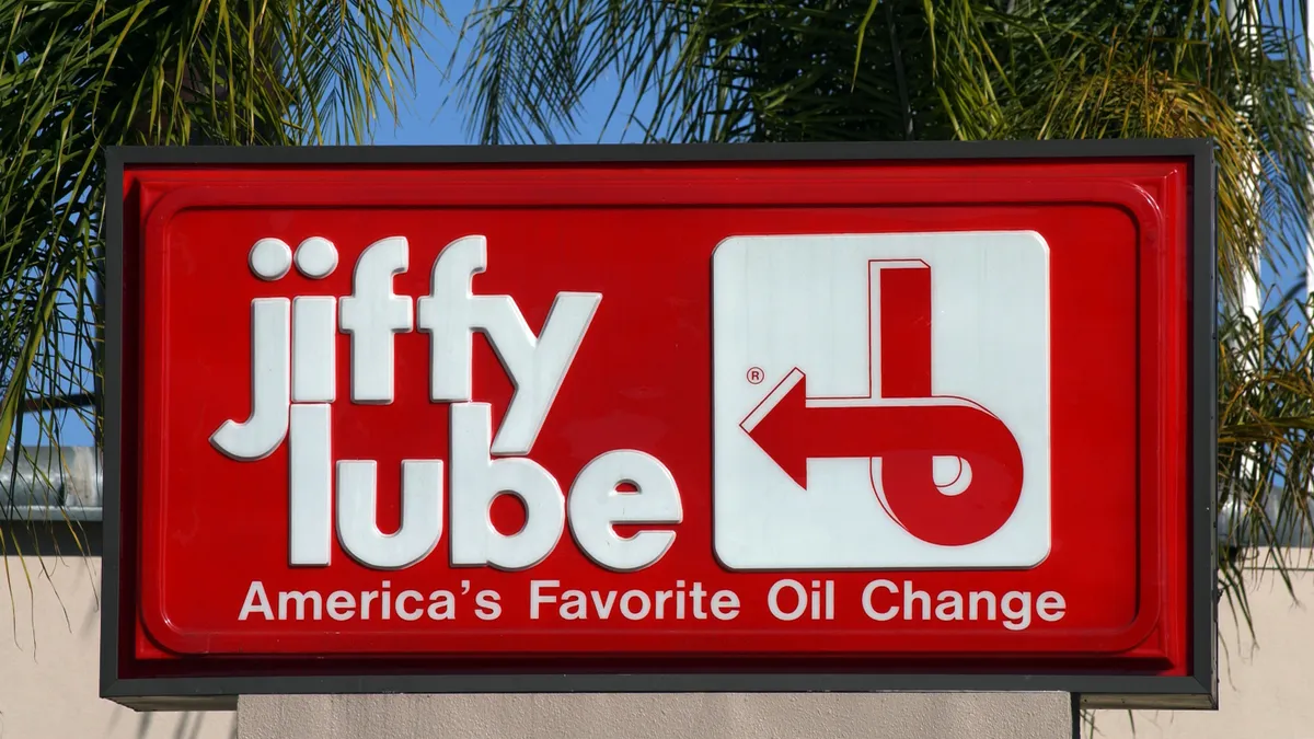 A store sign is seen at a Jiffy Lube store.