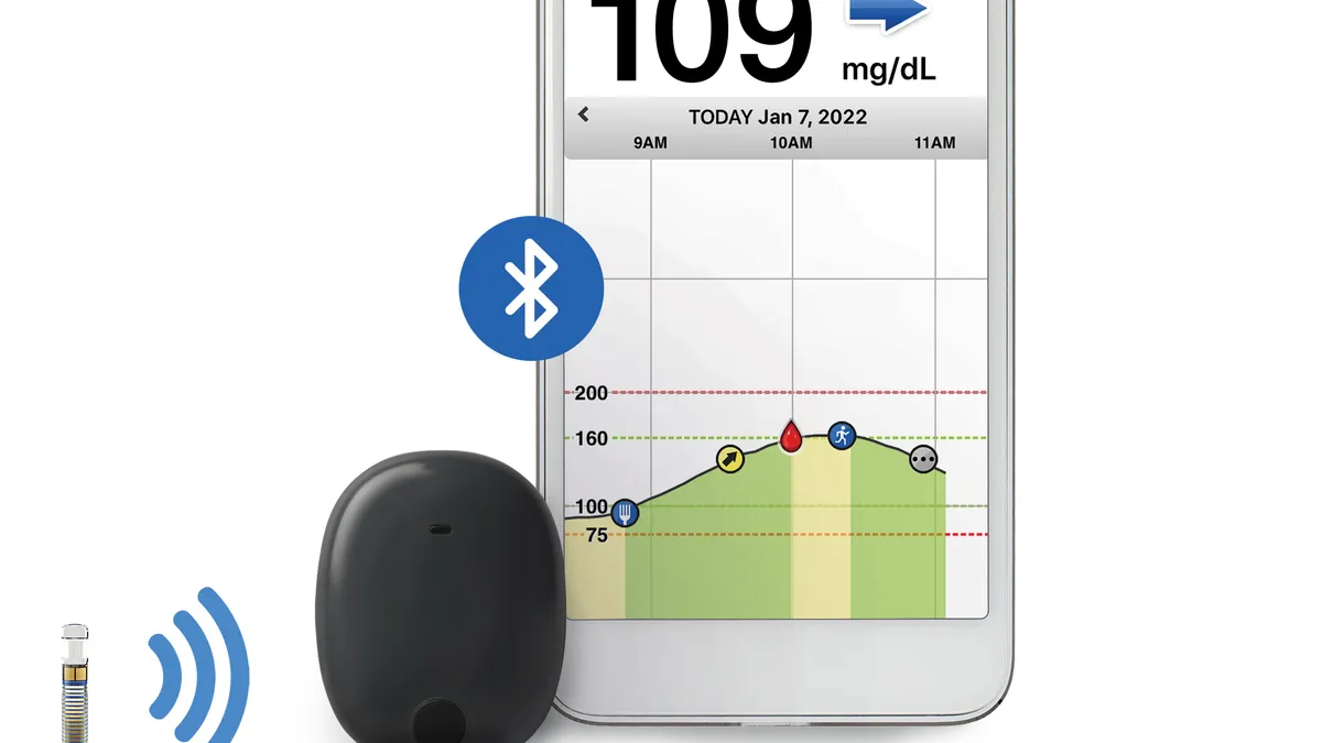 A cylindrical device on the left with a wifi signal, next to a black rounded device and a smartphone showing a blood glucose reading.