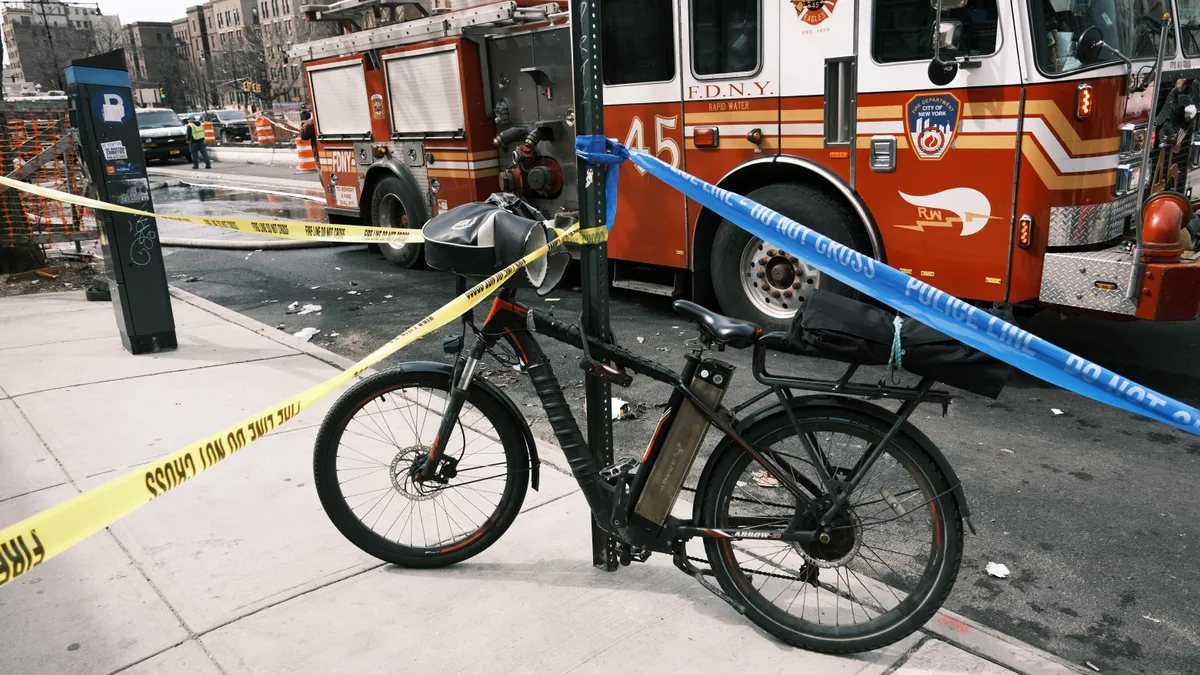 An electric bike parked outside a New York City supermarket.