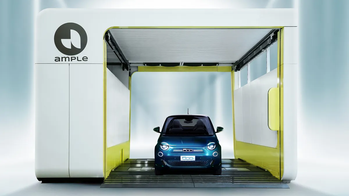 A Fiat 500e electric vehicle inside Ample's battery swapping station.