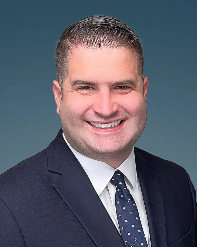 A headshot of Jason Kosek