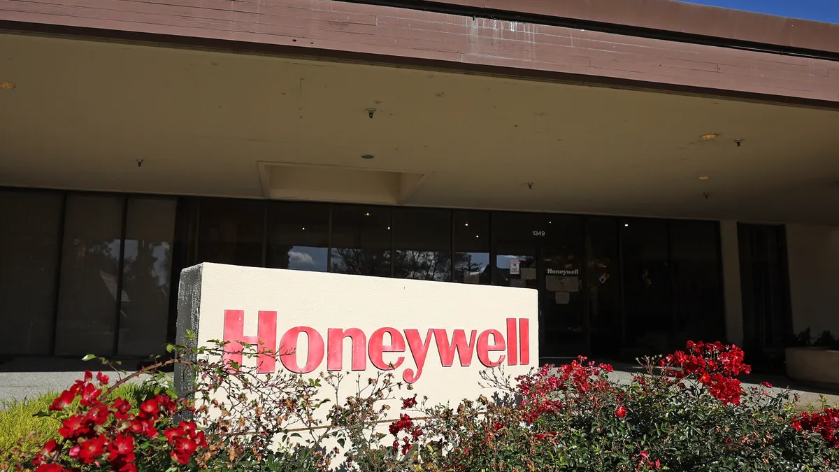 A Honeywell sign is posted in front of an office building.