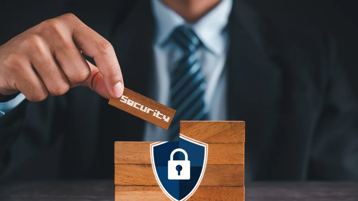 Information security protection concept privacy and safety in business investments. Businessman shows the word: SECURITY. - stock photo