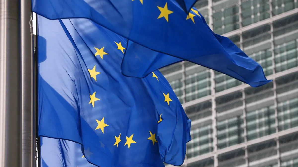 European Union flags are pictured waving outside the European Commission building.