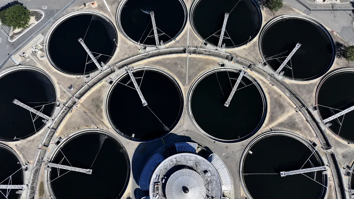 An aerial view shows large pools of water at a wastewater treatment plant
