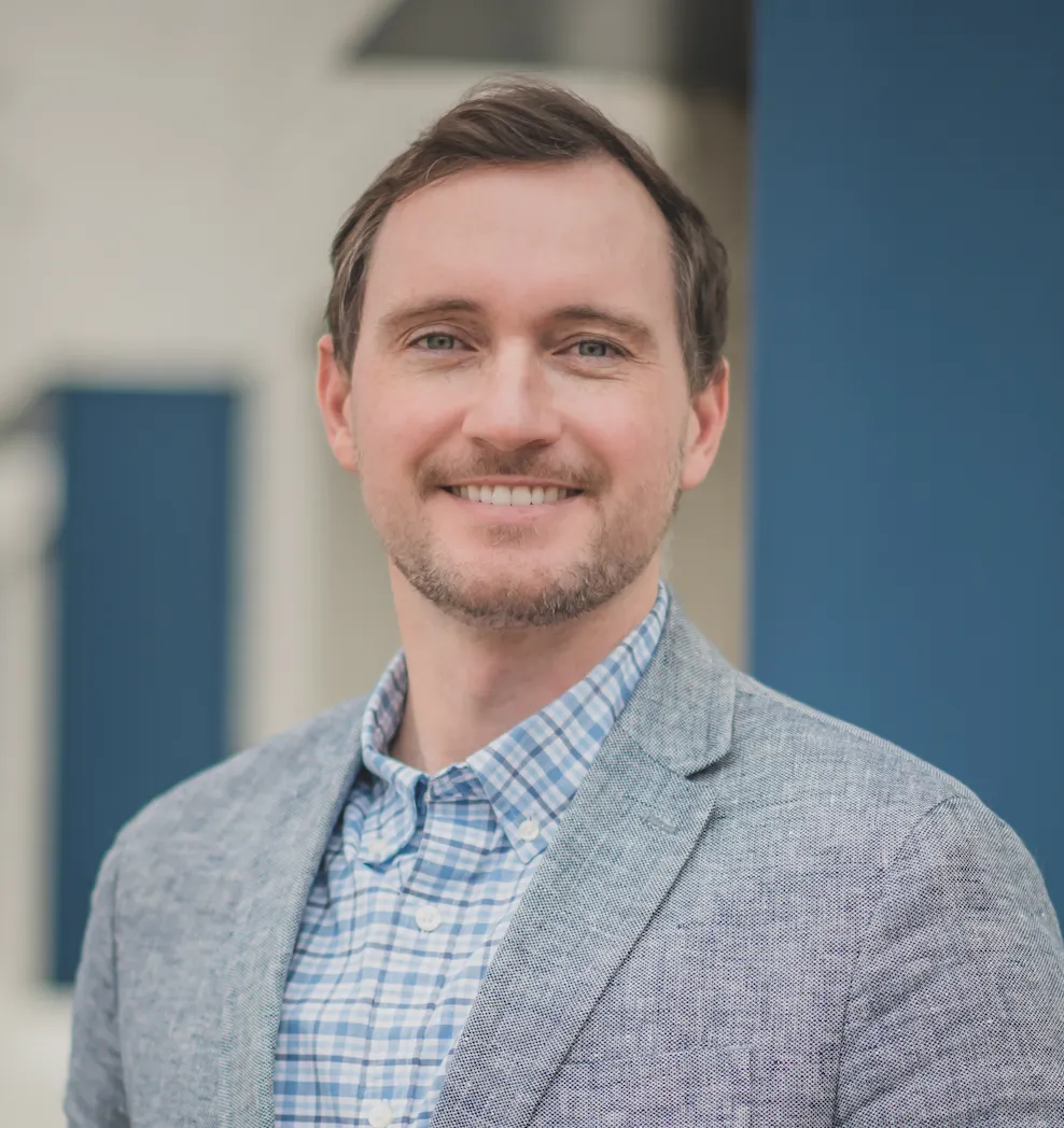 A male construction executive poses for a headshot.