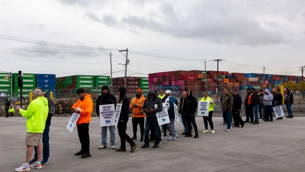 Dockworkers strike outside of the Port of Newark on October 1, 2024.