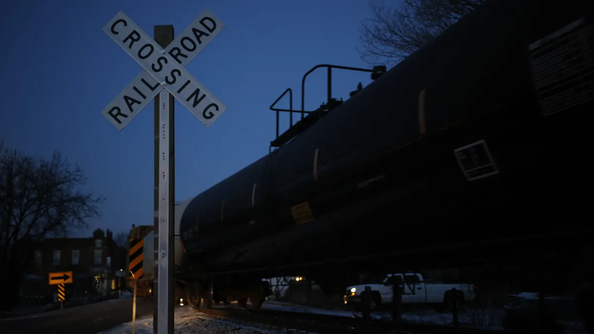 Railroad crossing sign at night