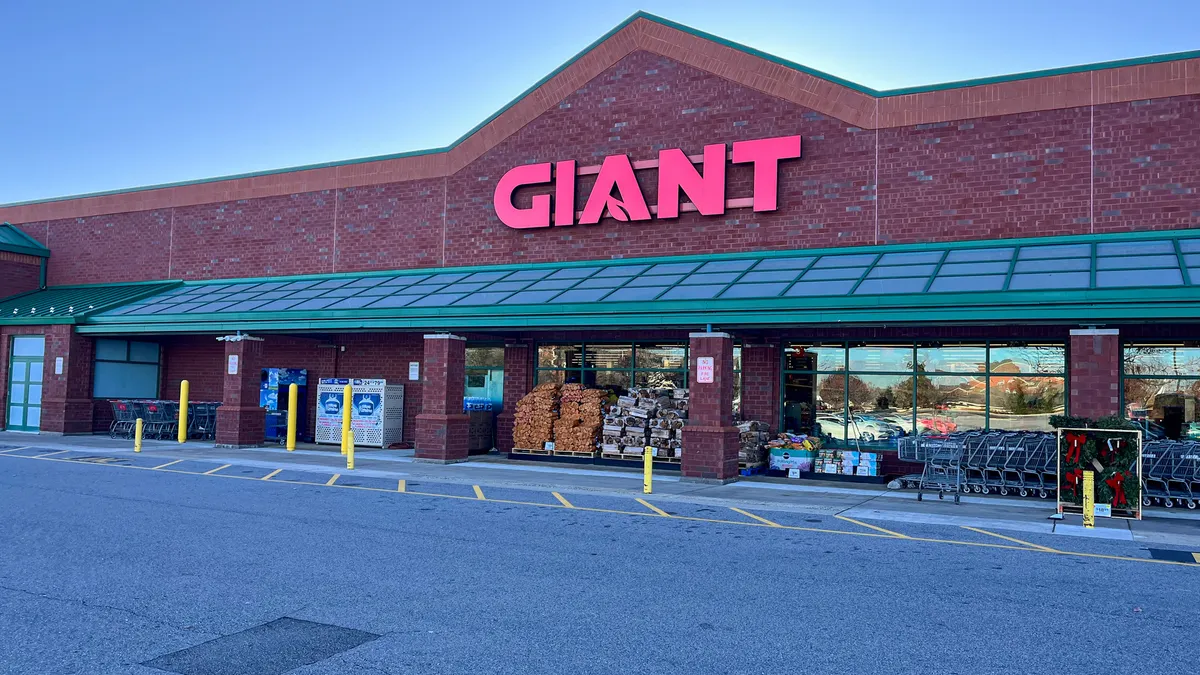 a brick and mortar supermarket store with Giant brand signage in red letters