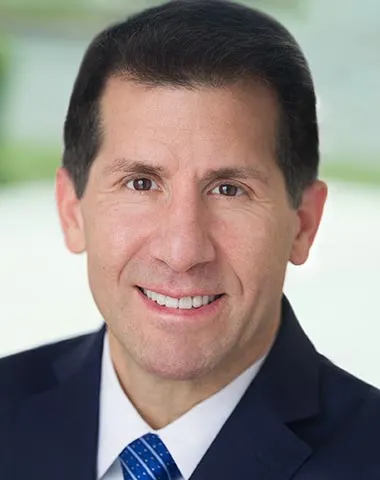 a headshot of John Shegerian