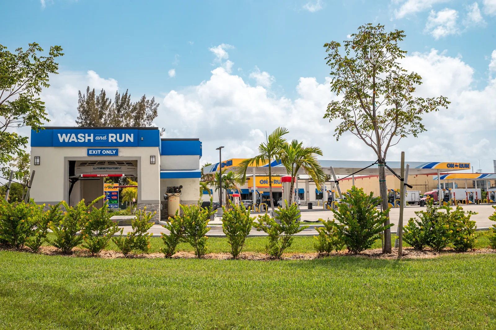 A photo of a Wash and Run car wash at an On the Go convenience store.