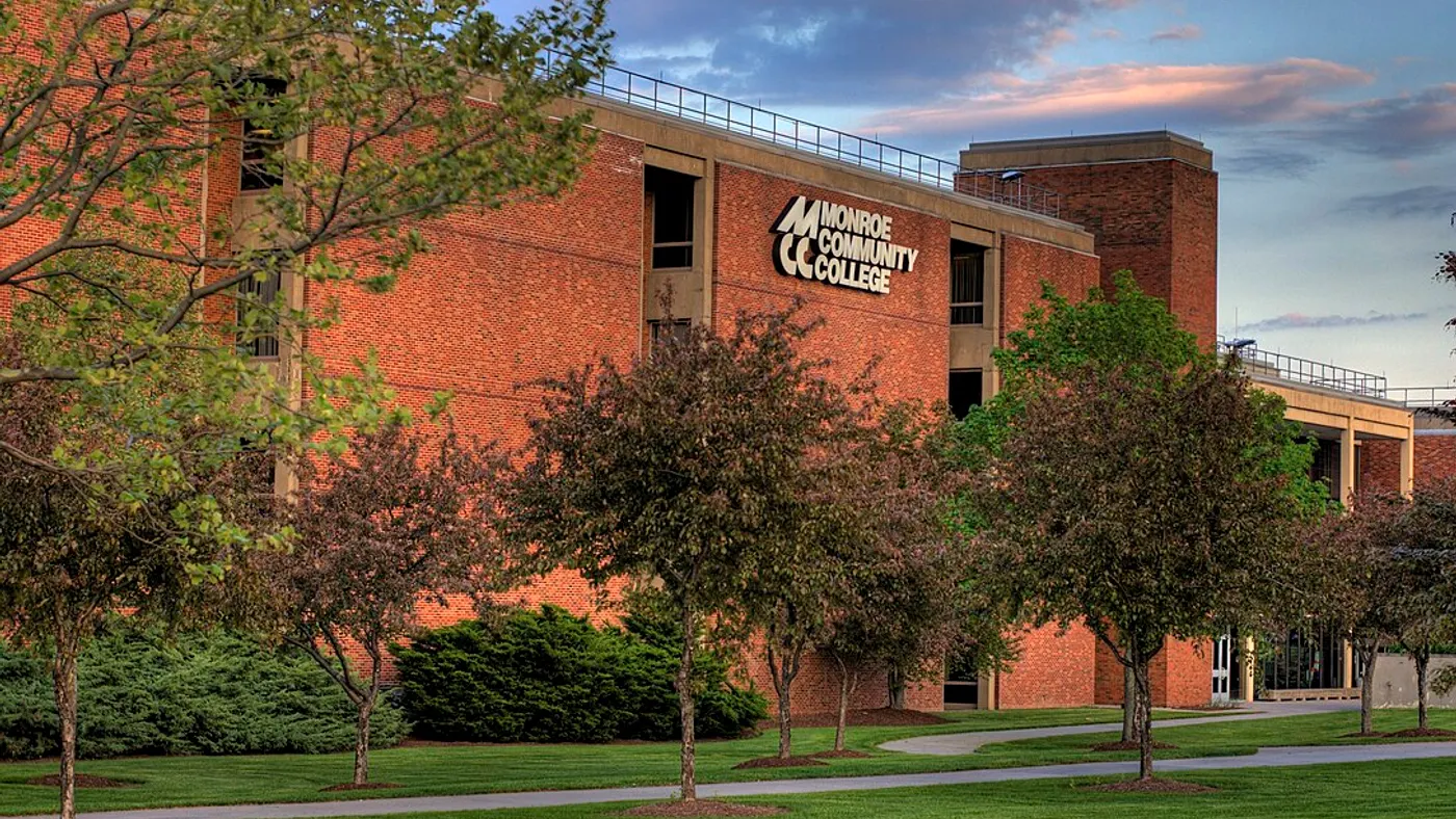 A building on Monroe Community College's campus featuring the institution's name.