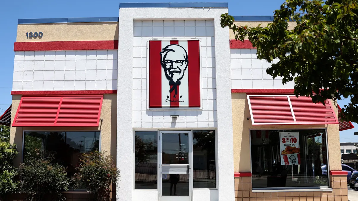 An imae of a white and beige restaurant with red awnings. The center is a logo of a person wearing glasses.