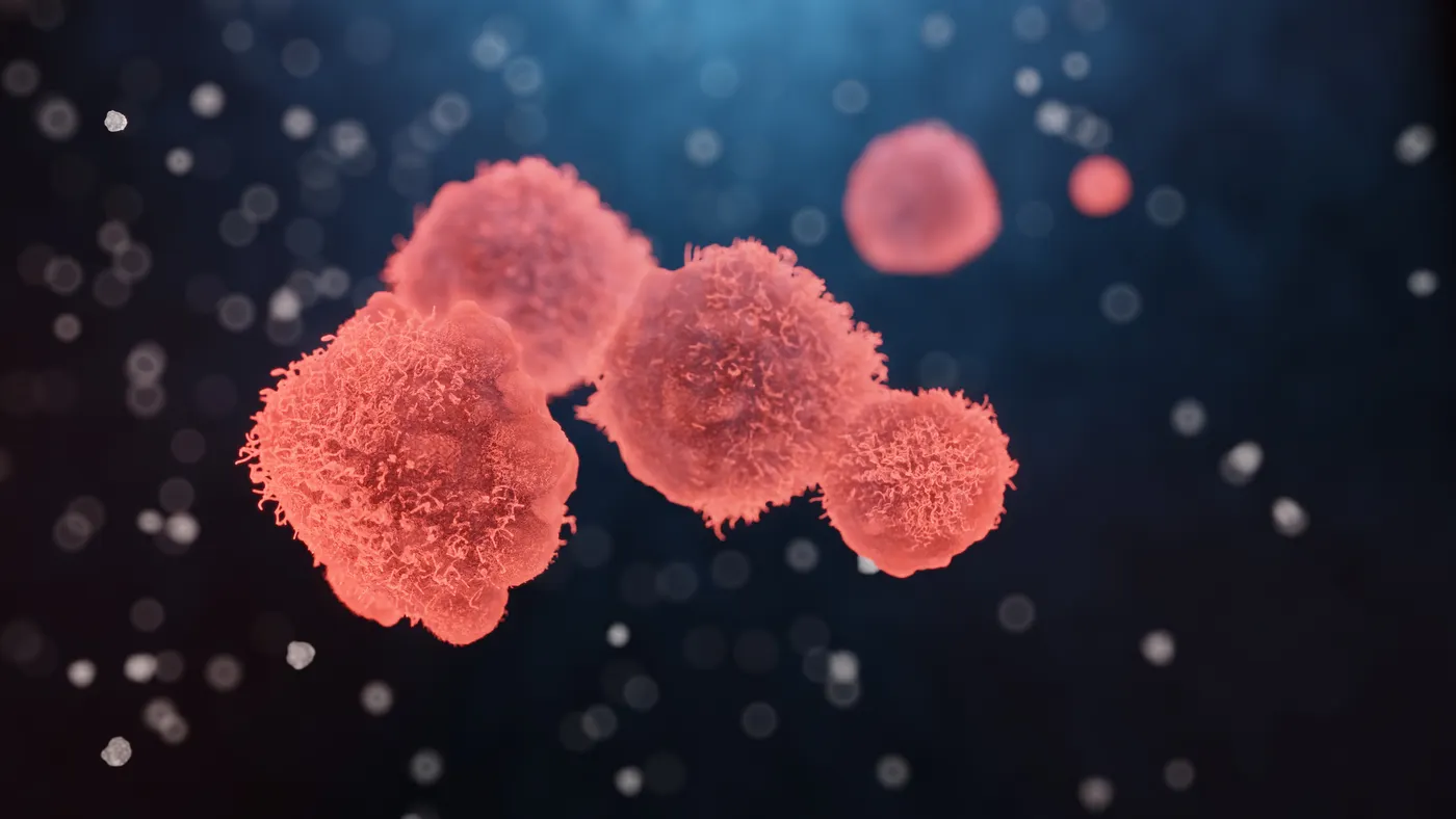 Illustration of cancer cells with textured surfaces against a dark blue background.