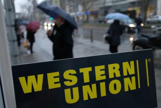 Western Union faces profit drop