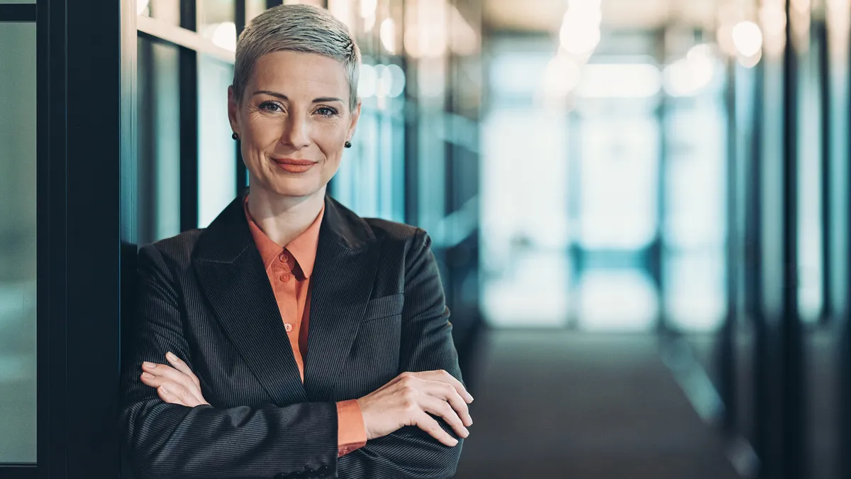 A woman lawyer stands in a corridor