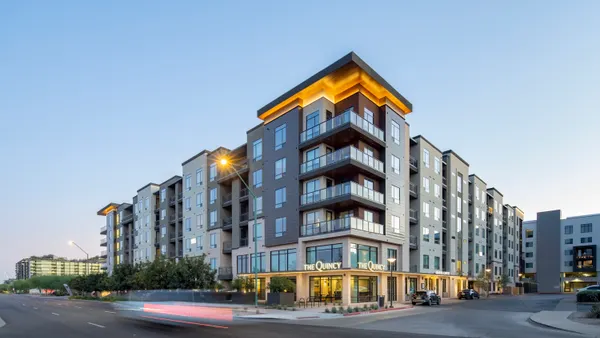 Modern mid-rise apartment building with glass