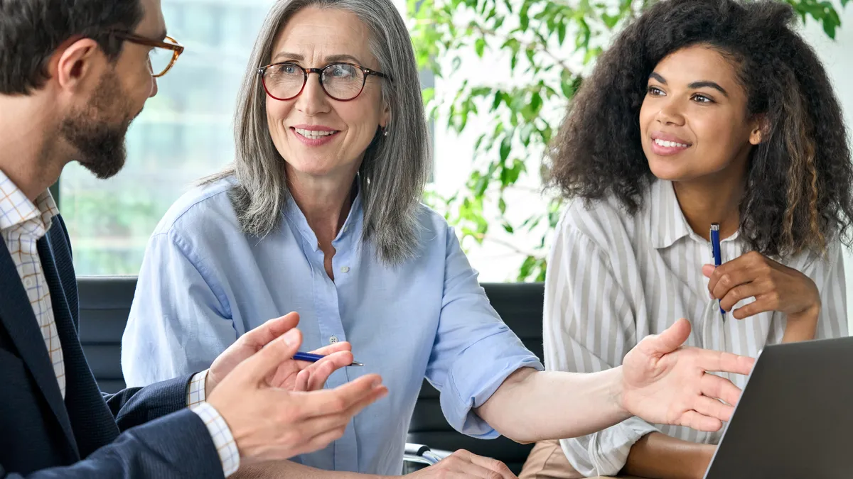 International business people discussing financial plan at boardroom meeting