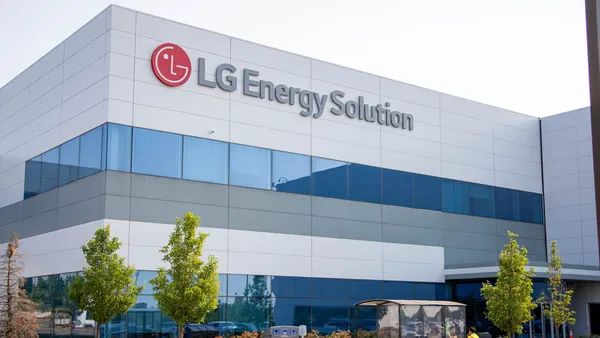 The white exterior of the LG Energy Solution battery plant in Holland, Michigan, showing the company's corporate logo.