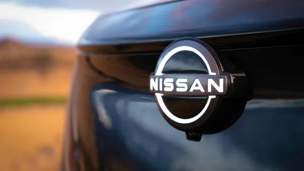 The front badge of the Nissan Aiyra electric SUV.