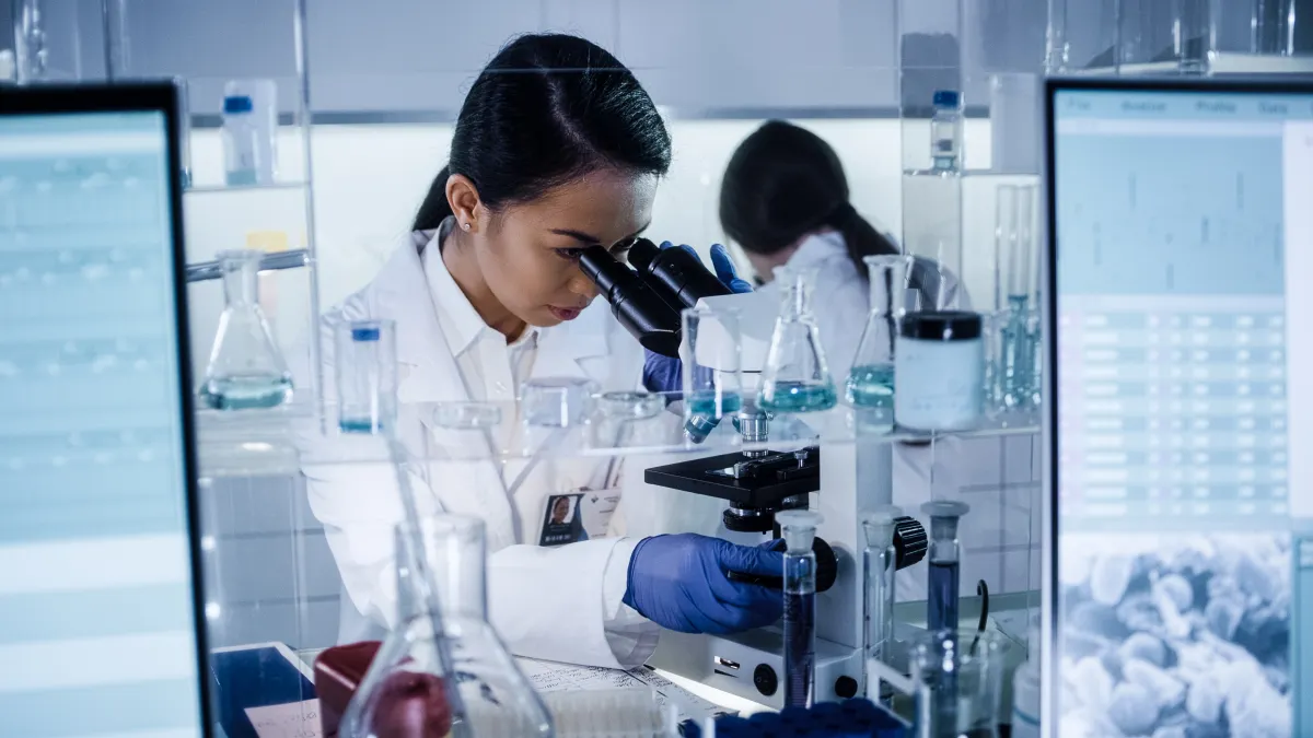 Young female physician working in a lab