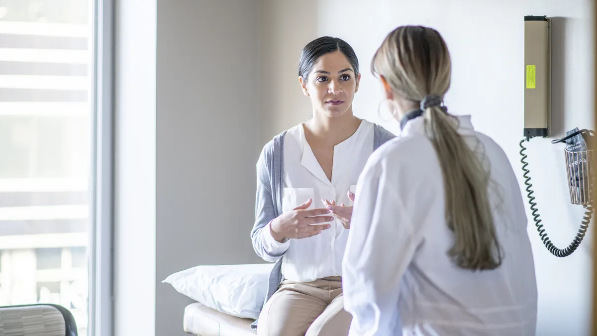 A woman with her physician