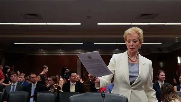 U.S. Department of Education Secretary Linda McMahon stands in front of Senate Appropriations Committee's Labor, Health and Human Services, and Education Subcommittee with papers in her hand