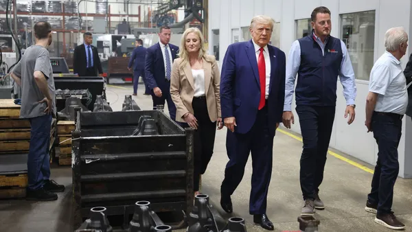 President Donald Trump tours Drake Enterprises, an automotive parts manufacturer on Sept. 27, 2023 in Clinton Township, Michigan.