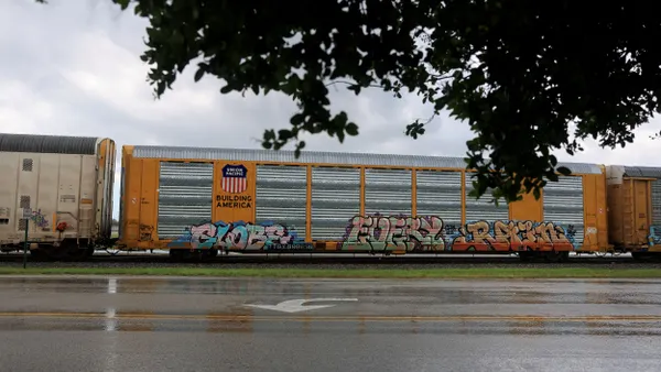 A boxcar bearing the name Union Pacific sits on railway track.