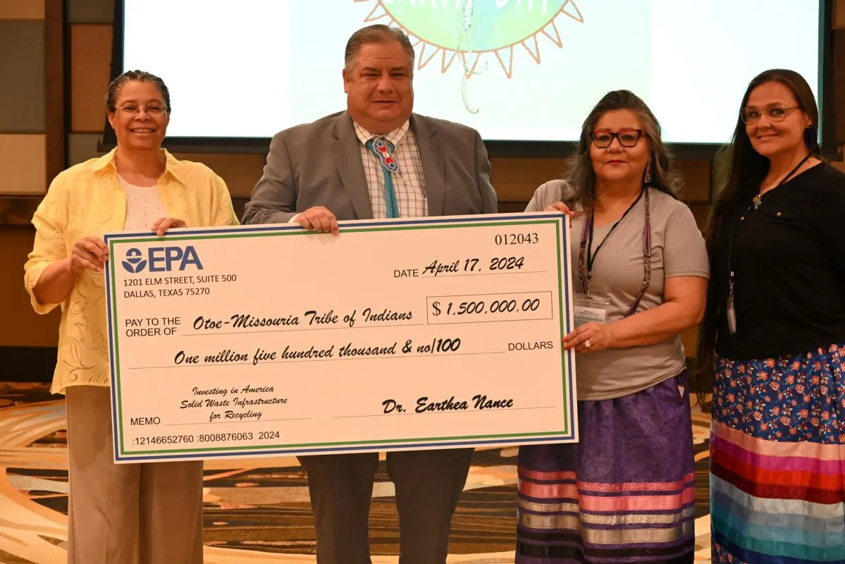 EPA Region 6 Administrator Earthea Nance holds a grant check with staff from the Otoe-Missouria Tribe